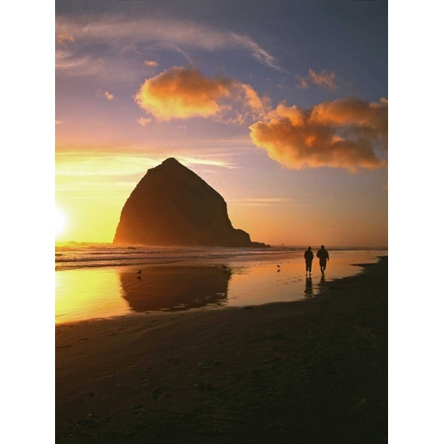 OR, Cannon Beach Couple by Haystack Rock, sunset